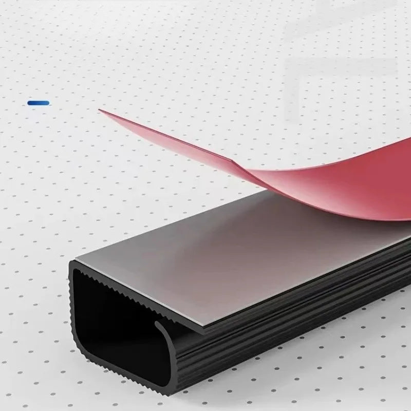 Peel-and-stick adhesive backing on the Under Desk Cable Tray for tool-free installation
